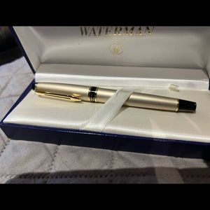 Waterman new in box gold ink pen.This was a gift and has never been used.